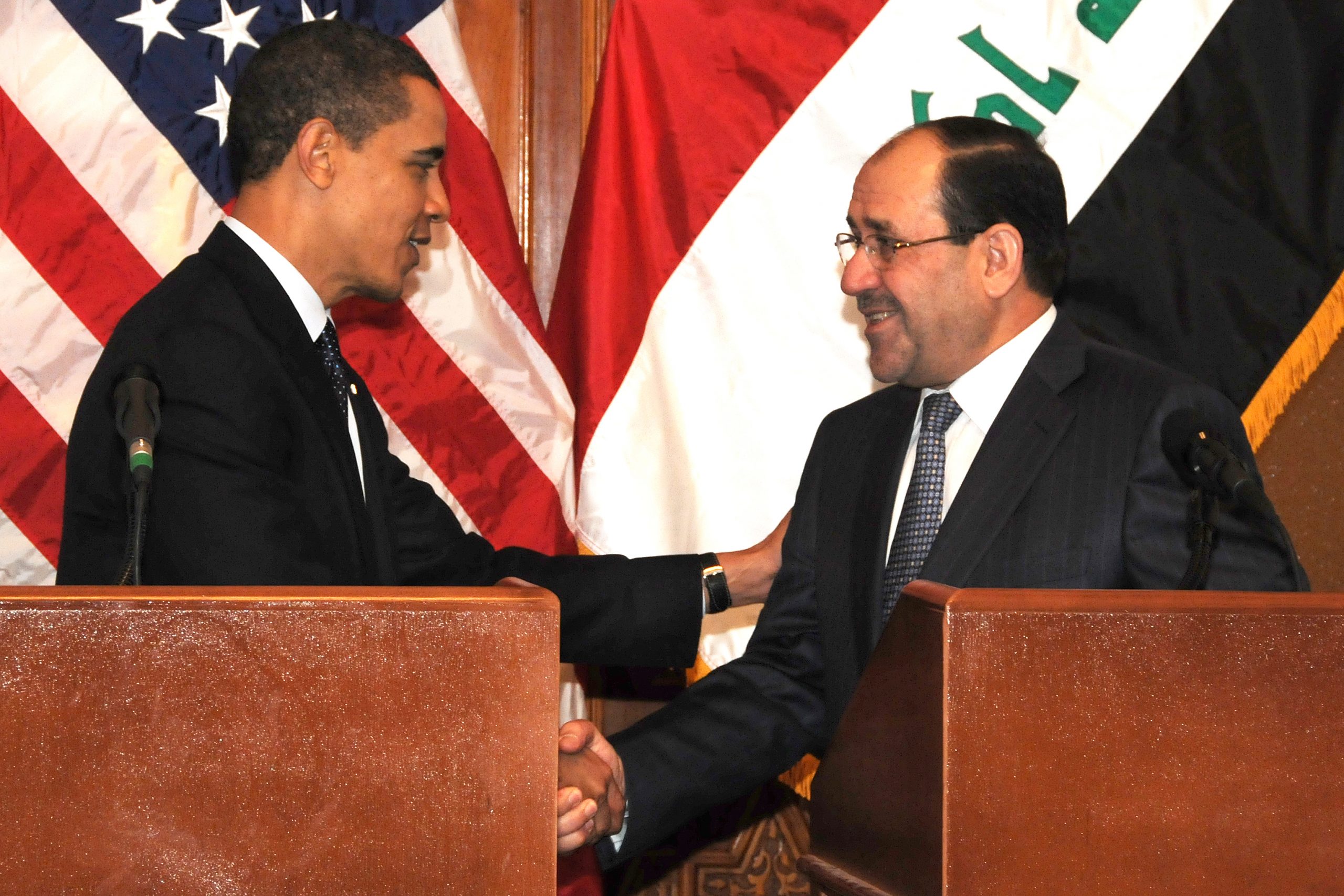 US President Barack Obama shakes hands with Prime Minister Nouri al-Maliki after a joint press event on Camp Victory, Iraq, April 7. (Photo by US Army Spc. Kimberly Millett, MNF-I Public Affairs)