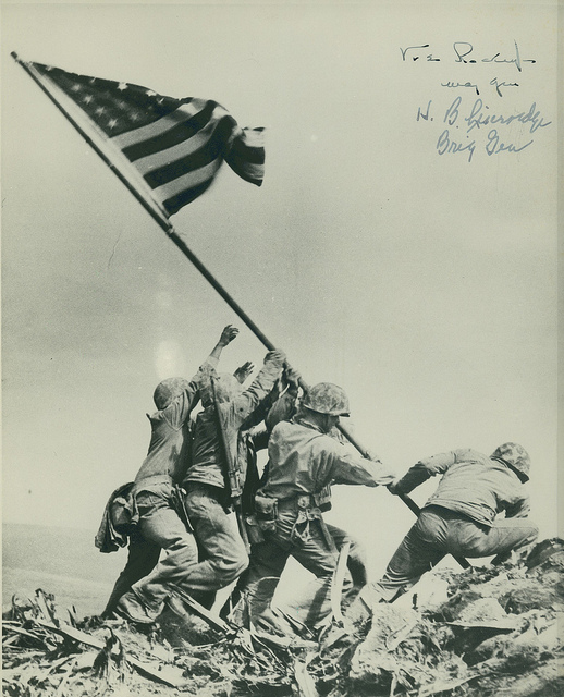 Historic photo of US troops raising the flag on Iwo Jima