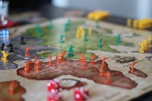 Strategy game board with plastic soldiers