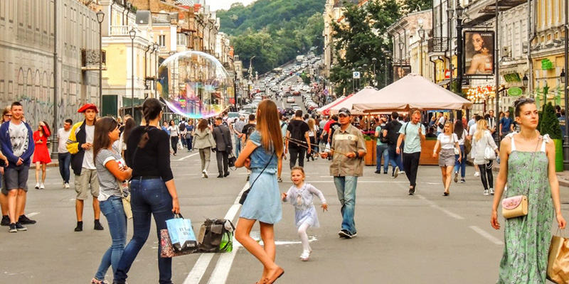 people walking around on a street