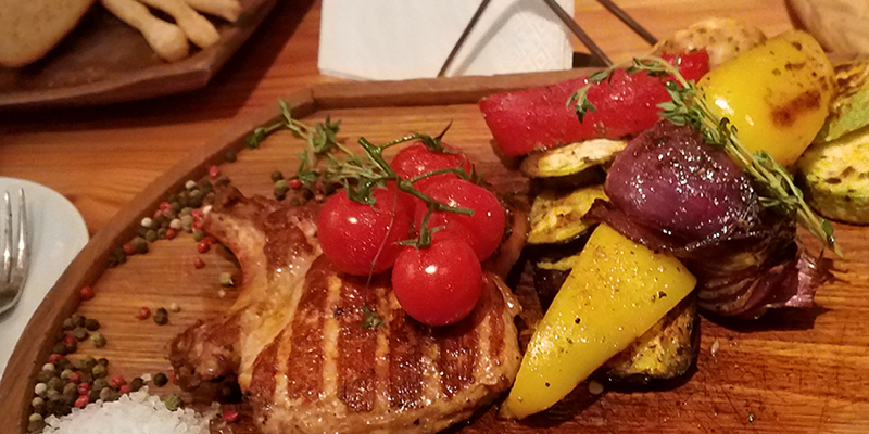 platter of tomatoes, vegetables, and meat