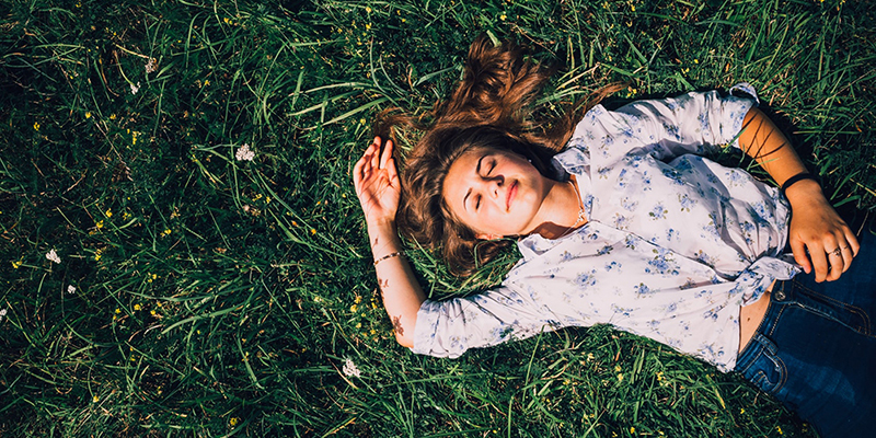 girl laying in grass