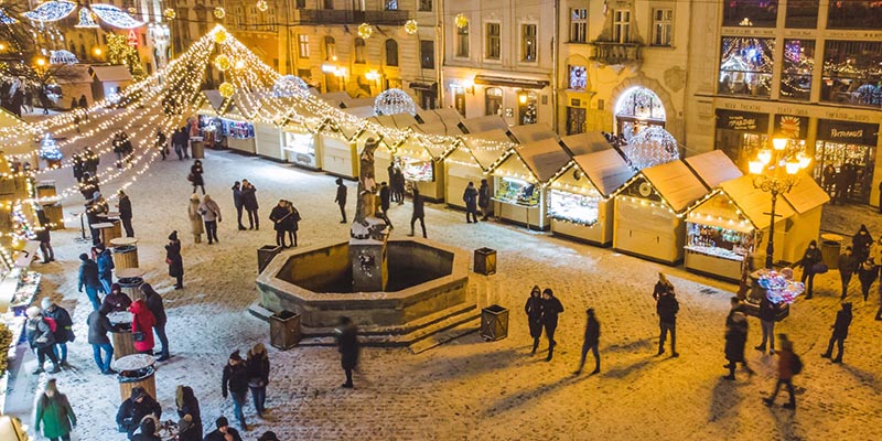 people walking around a market