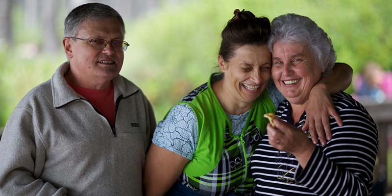 woman laughing with her parents