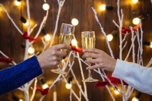 two people toasting glasses of champagne