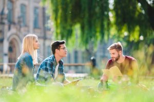 A small group of people sitting in an outdoor space