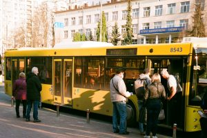 group of people boarding a bus