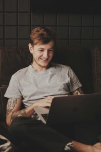 young man reading from a computer