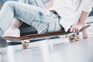 man sitting on skateboard