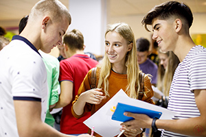 three students talking