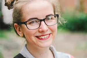 closeup[ of young woman wearing glasses