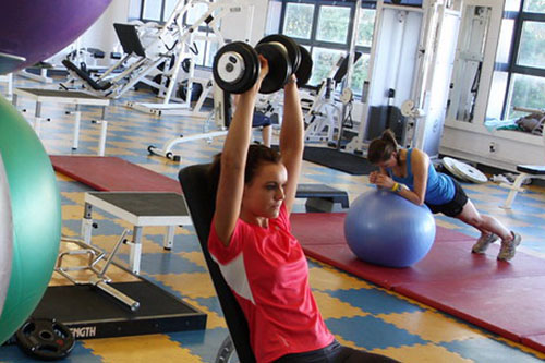 Female student working out at the gym