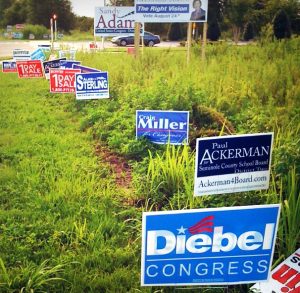 A corner lot full of political advertisements.