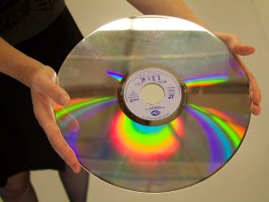 LaserDisc held in two hands.